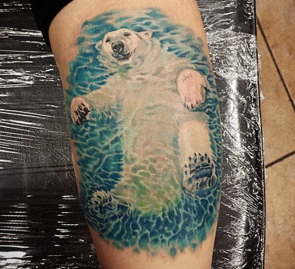 15 Realistic Polar Bear Tattoo Designs And Ideas PetPress Polar Bear Tattoo Animal Water