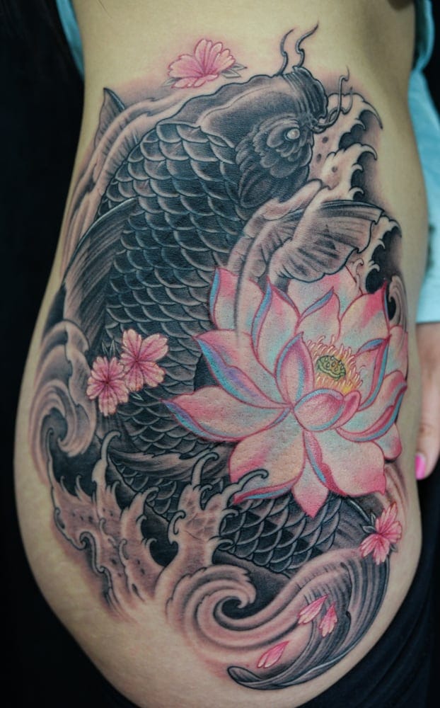 Koi fish with lotus flowers tattoo