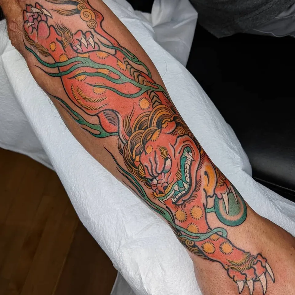 arm foo dog tattoo